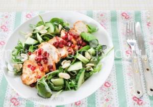 Spicy chicken tikka with greens, pomegranate and peanuts.